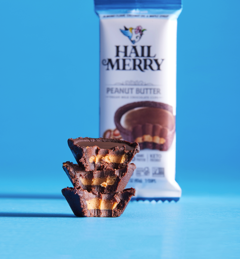 Stack of Raw Vegan Chocolate Peanut Butter Cups outside of individual pack. Organic and Healthy Snacks 