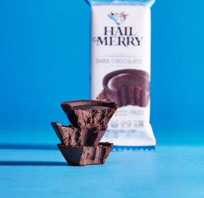 Hail Merry Dark Chocolate Cups and Espresso Cups stack of three cups in front of package. Free shipping. Vegan. Organic.